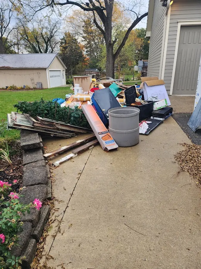 Dumpster being loaded with debris for Roofing Dumpster Rental in Milford Mill